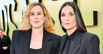 Demi Moore, 60, shows off her ageless beauty as she poses with her first grandchild