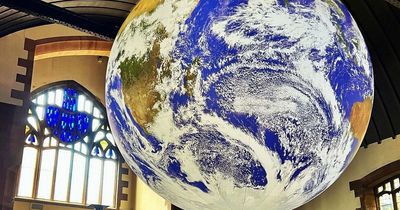 Incredible 'floating earth' installation at Glasgow church suspended in air