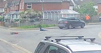 Drink driver knocks over cyclist and drives over her as she's trapped under car