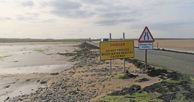 Four people rescued from Holy Island causeway after becoming stranded 'waist deep' in water