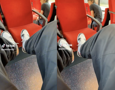 Train passenger sparks debate by putting his feet up on empty seat