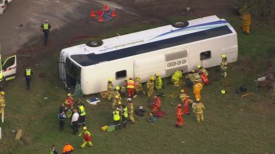 Truck and school bus collide at Eynesbury, west of Melbourne, leaving 10 children seriously injured