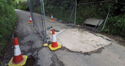 Residents refuse to snitch on 'hero vigilante' who filled 10ft pothole that shut road