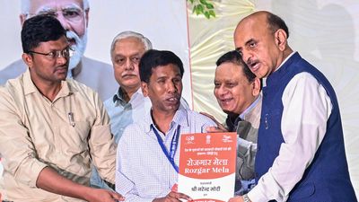 Union Minister Bhagawat Karad hands over appointment letters to new recruits in Rozgar Mela in Visakhapatnam