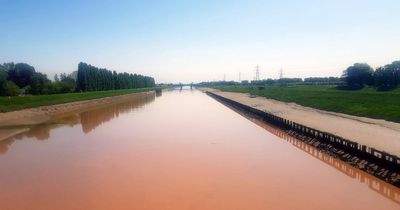 River turns ORANGE overnight as worried locals say 'it's like the plagues of Egypt'