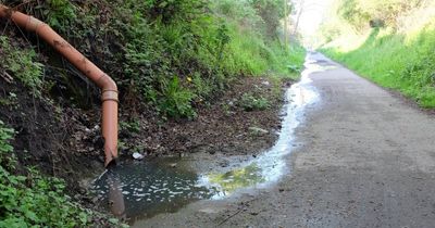 Disgusted Midlothian locals spot 'stinking' water spewing onto cycle path