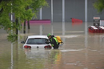 3 dead as heavy rains in northern Italy burst riverbanks, flood towns