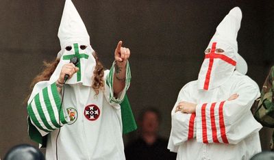 Teacher who allowed student to wear KKK costume banned from school