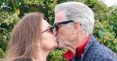 Pierce Brosnan shares a tender kiss with his rarely seen wife Keely, 59, as he turns 70
