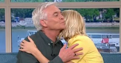 This Morning: Viewers cringe at awkward Phillip kiss as Holly Willoughby leaves set early