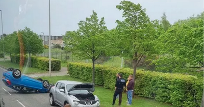 Car overturns on busy Edinburgh road as emergency services rush to scene