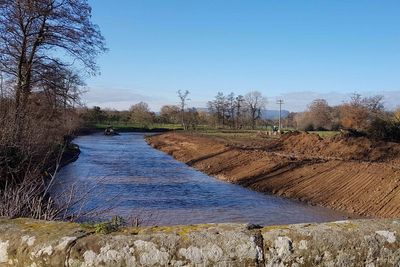 Farmer jailed for ‘outrageous’ illegal bulldozing of riverbank has term reduced