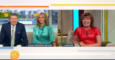 Lorraine Kelly blushes and tells Good Morning Britain's Ben Shephard to 'behave' over remark as she dons red leather