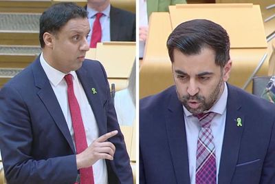 Why are MSPs wearing green badges at FMQs?