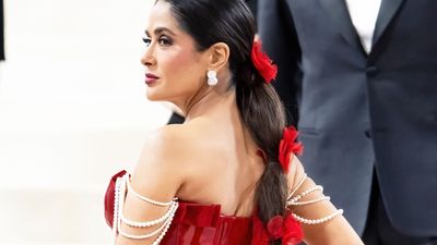 Salma Hayek has slight wardrobe malfunction while dancing around in a bathrobe