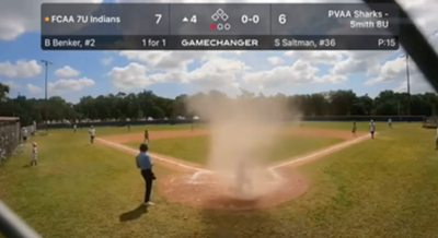 Little League Umpire Rescues Player From A Mini-Tornado