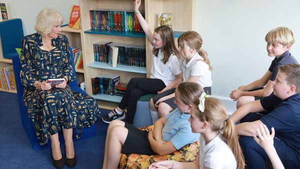 Queen Camilla shows her thrifty side as she re-wears her go-to feather dress for the 5th time