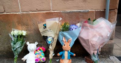 Floral tributes and toys left at scene for Paisley boy Kayden Frank found dead in flat