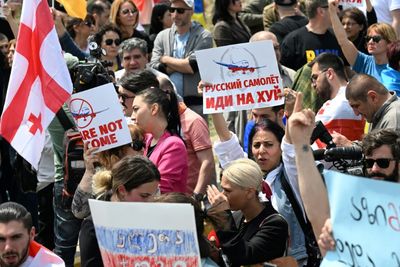 Protests greet first Russian plane to land in Georgia in years