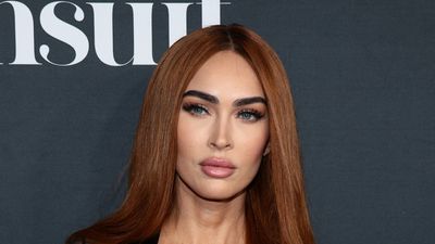 Megan Fox Rocked Red Hair And A Sheer Dress To Her Sports Illustrated Cover Event, And MGK Showed Up In Support