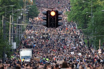 Tens of thousands gather in Belgrade protest over mass shootings
