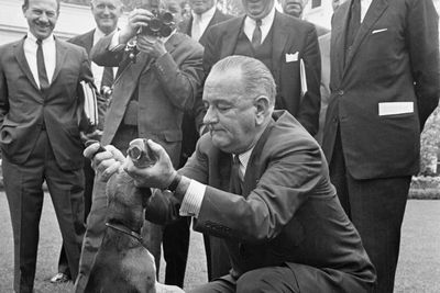 LBJ picked up his dog by the ears