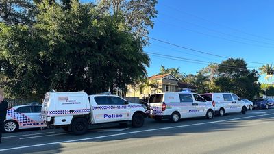 Man shot dead by police after reports of stabbing in Brisbane suburb of Grange