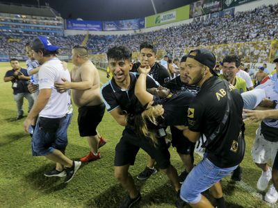 At least twelve people have died in a stampede at a soccer stadium in El Salvador