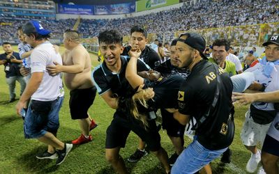 Stadium stampede at El Salvador football match kills 12