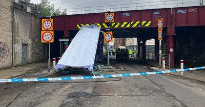 Roof sliced off Glasgow double decker bus in railway bridge crash amid ongoing incident