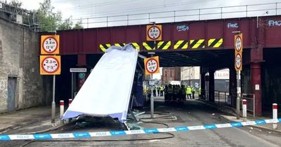 Ten injured after double-decker bus crashes into low bridge and entire roof ripped off