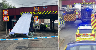 Ten people rushed to hospital after Glasgow bus crashes into railway bridge causing travel chaos