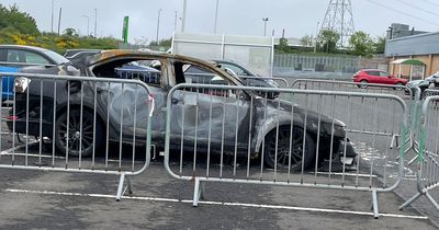 Car set on fire in Edinburgh Asda car park as burnt out shell remains cordoned off