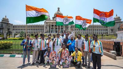 Congress workers perform rituals with cow urine at Vidhana Soudha symbolising washing away ‘corrupt BJP government’