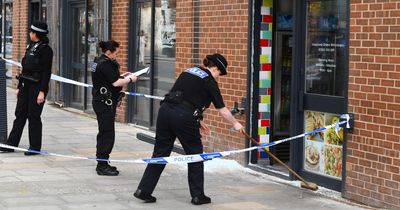 Police shout 'everyone stay inside' as they smash shop windows