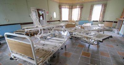 Inside abandoned psychiatric hospital left to rot with dumped coffin in creepy basement