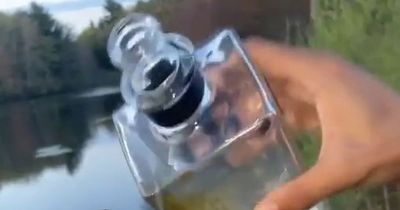 Laughing anglers slammed for 'pouring booze' down panicked fish's throat before throwing it