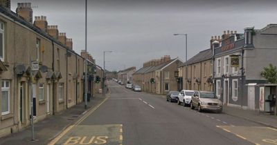 Stranger walks into woman's kitchen before collapsing on floor