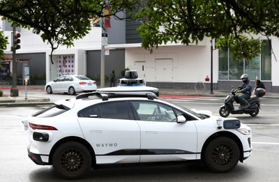 Uber taps into self-driving tech of former rival Waymo