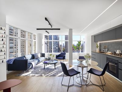 The sliding divider in this New York apartment creates a 'temporary room' – a genius trick for flexible open plan living