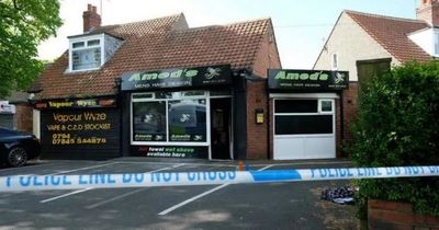 Man lying on street 'on fire' after 'arson attack' at barbers as four rushed to hospital