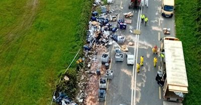 Massive clean-up underway after battery acid and oil spills from overturned lorry