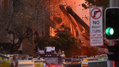 Thousands watch as walls collapse after huge blaze engulfs building in Sydney's Surry Hills