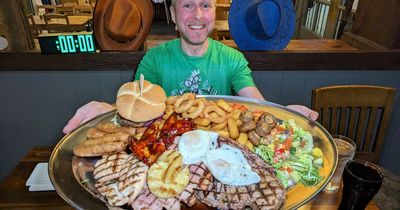 Man in agony after devouring 4,500 calories mixed grill challenge in 27 minutes