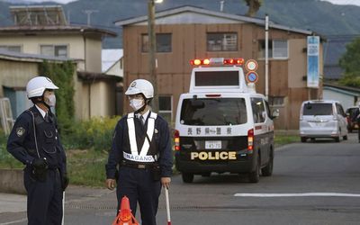 Siege under way in central Japan after three killed in attacks