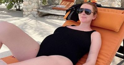 Pregnant Lindsay Lohan glows as she shows off blossoming baby bump in swimsuit