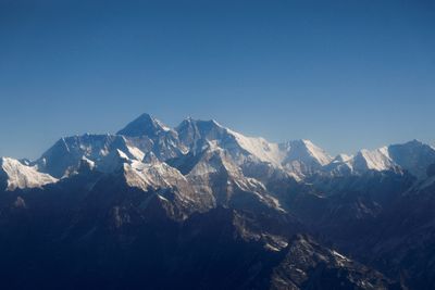 U.S. mountaineer climbs rare Everest 'triple crown' as death toll reaches 12