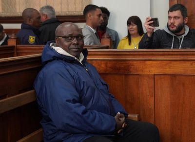 Rwandan genocide suspect appears in court holding Bible after 22 years on the run