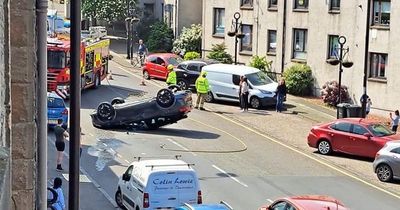 West Lothian car flipped onto roof in busy high street after two-vehicle crash