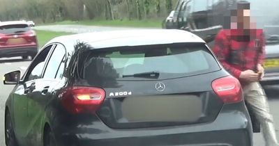 Moment man pulls up in front of speed camera van and slashes tyre